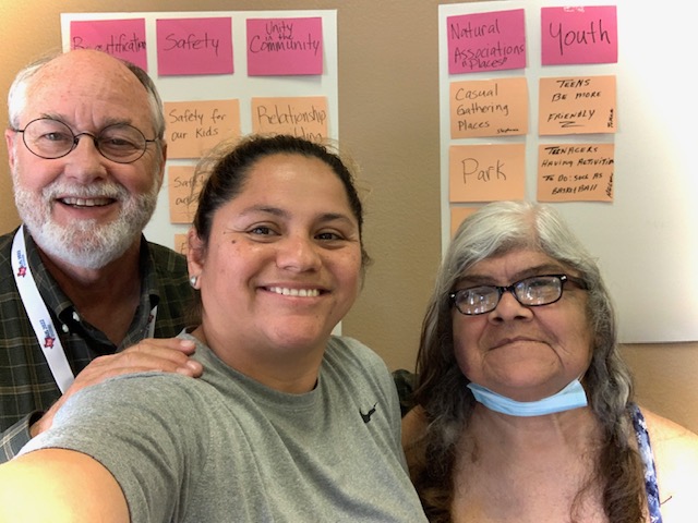 Smiling community members at a CBCE planning session
